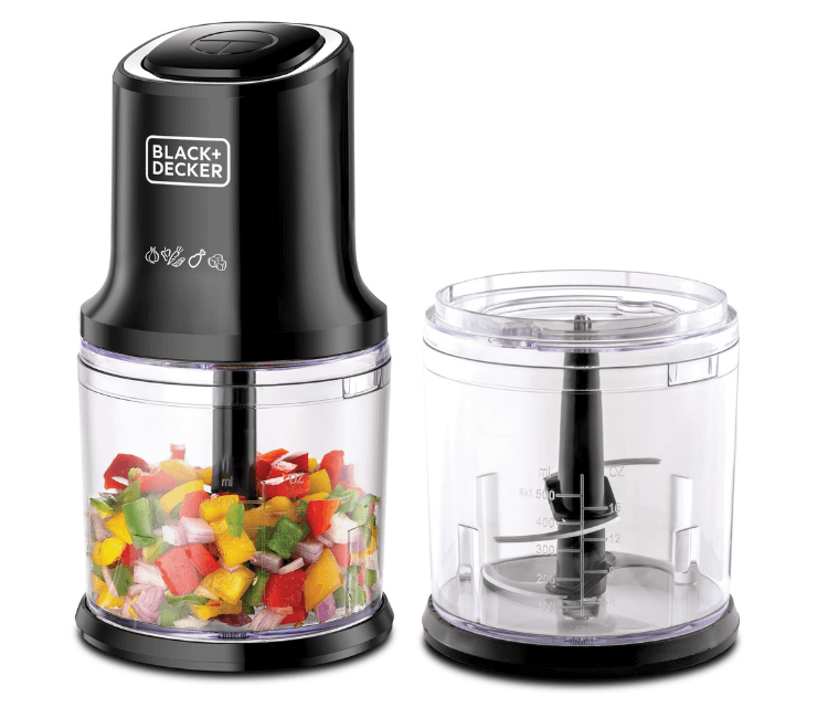 Close-up shot of the Black+Decker FC500-B5 Food Chopper processing vegetables with its durable stainless steel 4-blade system and pulse function.